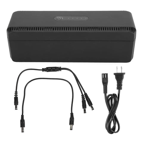 Check Out This Awesome UPS Battery Backup That Gives You Reliable 10400mAh Of Backup Power In A Pinch And Also Serves As A Go To USB Power Bank With 18W Of Multi Output Juice For Your Devices Using The US Plug, showing black power bank with cables.