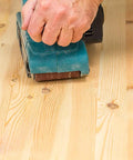 Hand using 3x21 inch belt sander on wood with Pro Grade Aluminum Oxide Sanding Belt Set For 3x21 Inch Belt Sander