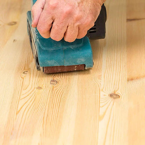 Hand using 3x21 inch belt sander on wood with Pro Grade Aluminum Oxide Sanding Belt Set For 3x21 Inch Belt Sander