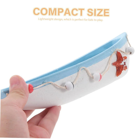Hand holding compact size Mediterranean Style RC Sailboat Ornament Wooden Sailing Boat Model for home decor