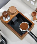Top view of Heavy Duty Wooden Espresso Knock Box With 58mm Tamper Base, featuring espresso grounds and tamping tools.