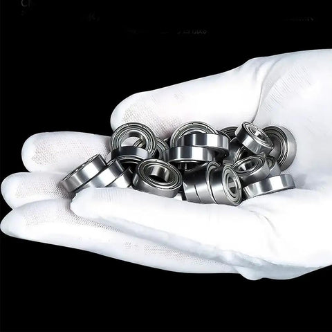 Five Pcs Premium R144 ZZ Miniature Deep Groove Ball Bearings in hand, showcasing high quality steel and precision polishing.