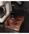 Straight Up Organized Espresso Tamper Station With Universal 51 To 58mm Base And Built In Powder Dispenser Premium Walnut Barista Organizer on dark counter.