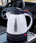 12V Car Electric Kettle With Auto Shut Off Portable Water Heater for Long Distance Runs, compact kettle on vehicle dashboard.