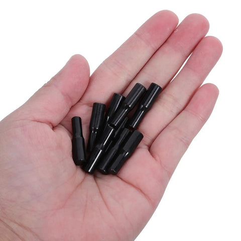 Hand holding Beefed Up Shelf Support Pegs With Rubber Covers Black Carbon Steel 24 Pack Keep Cabinets Level Prevent Sagging And Balance