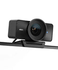 Smooth 4K Webcam With 60fps Streaming Speed And Sony Starvis Sensor positioned on monitor, showcasing lens detail and sleek design.