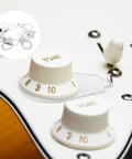 Close-up of Metal Guitar Knob Position Markers 10 Piece Dope Set Indicator Plates for tone and volume on electric guitar control plate