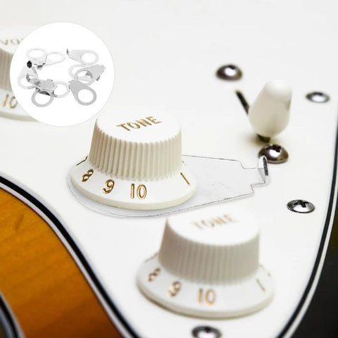 Close-up of Metal Guitar Knob Position Markers 10 Piece Dope Set Indicator Plates for tone and volume on electric guitar control plate