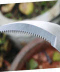 Close-up of serrated blade on Two Piece Portable Grass Scythe And Weeding Tool Set For Garden