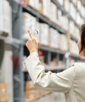 Person holding Heavy Duty Metal Safety Latch Pins for Pallet Racks and Shelving Systems in warehouse. Focus on 7mm drop pin.