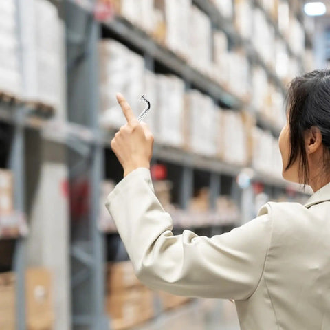Person holding Heavy Duty Metal Safety Latch Pins for Pallet Racks and Shelving Systems in warehouse. Focus on 7mm drop pin.