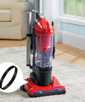 Heavy Duty Vacuum Belt Replacement Set 2 Pack For Dirt Devil Featherlite Swivel Glide Powerlite And Power Max Pet Uprights Plus Vision Uprights Replace 3720310001 shown beside a red vacuum cleaner on a carpeted floor in a living room with a couch in the background.