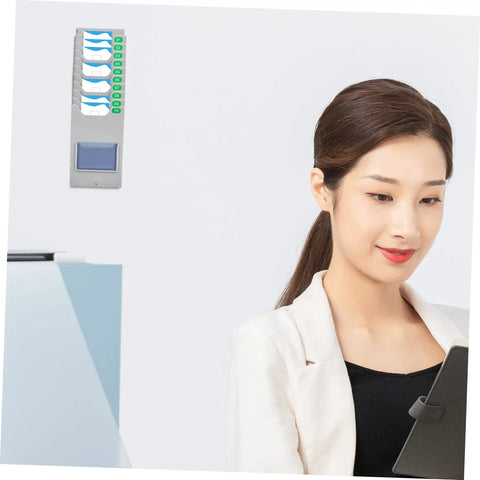 Hella Easy Wall Mounted Material Card Rack For Warehouse Inventory Display And Employee Attendance Tracking With Super Dope Multi Grid Card Slot Shelf For Slick Storage Setup mounted beside a woman using a tablet.