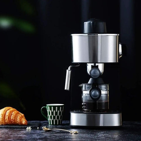 Compact Semi Automatic Coffee Maker Featuring 5 Bar Pressure Pump For Creamy Lattes And Bold Espressos Silver Steam Frother on countertop with coffee cup and croissant.