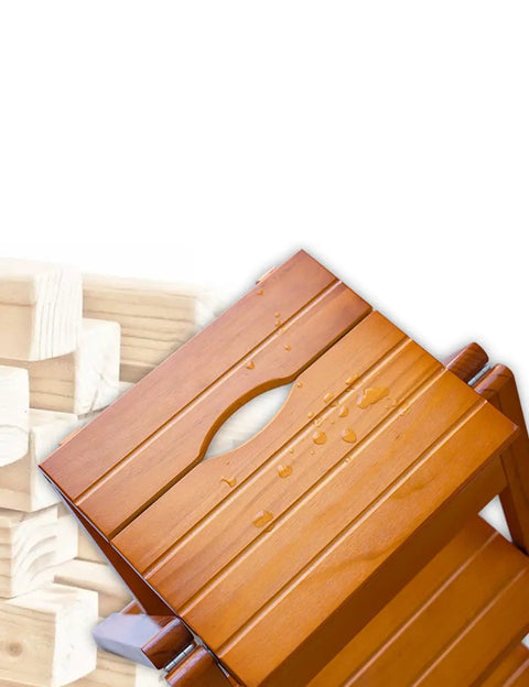 Close-up of 3 Step Wooden Folding Stool Chair With Solid Pine Frame, showing top step with water droplets, sturdy and portable.
