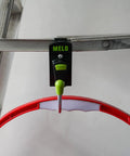 Red and green 180 Degree Rotating Cordless Drill Holster Hook With Foldaway Design attached to a metal surface