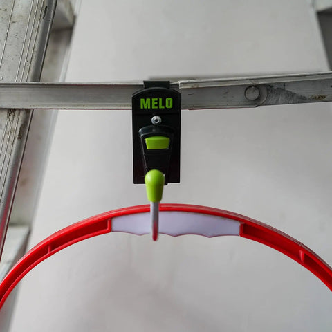 Red and green 180 Degree Rotating Cordless Drill Holster Hook With Foldaway Design attached to a metal surface