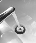 Rubber Bathtub Drain Stopper Plug with Stainless Steel Seal in bathtub with water flowing, showcasing installation and functionality.