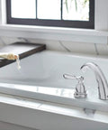 Elmhurst Roman Tub Trim Kit Chrome For 3 Hole 8 To 16 Inch Installations, ADA Compliant, Easy Install shown on a tub