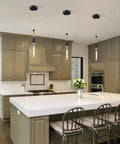 Kitchen with black cylinder crystal pendant light, dimmable 5W LED over island, modern sleek design for versatile settings.