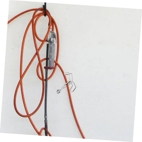 15 Pack Water Hose Clips Shut Off Flow Control Crimp Spring Clamps For Tubing displayed with orange hose against wall