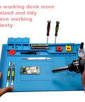 Pro Grade Heat Resistant Soldering Mat 932F Silicone Anti Static Magnetic Electronic Repair Work Surface in use with tools.