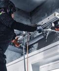 Person using Straight Up Kickass Core Drill And Stand With 4.29 Hp Motor Three Speed Gears for concrete drilling.