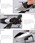 Close-up of C129 V2 RC Helicopter showing propellers, composite materials, and detailed structure.