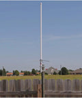 Pre-Tuned Dual-Band Base Antenna For Amateur Radio 144-148 MHz VHF And 430-460 MHz UHF White Fiberglass 43-Inch in outdoor setup