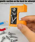 Bright orange Magnetic Door Hinge Jig Set Four Piece Quickly Aligns And Mounts Hinges Hands Free With 2mm Gap Locator shown held.
