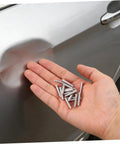 Grab 50 Durable Metal Panel Pulling Studs For Auto Body Work. Silver welding pins in hand for car dent repairs.