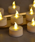 Battery Operated LED Tea Lights Set Of 100 Flameless Tealights With Warm Yellow Glow For Weddings Parties And Home Decor No Fuss Setup 200 Plus Hours Runtime Easy On Off Switch displayed on a tray