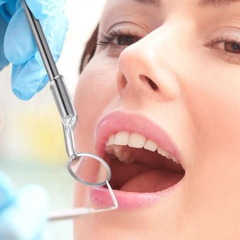Using LED Lighted Stainless Steel Mouth Mirror For Teeth Inspection And Plaque Removal during an oral check