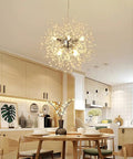 Modern kitchen with 9 Light Chrome Crystal Dandelion Firework Chandelier With Adjustable 78 Inch Cord glowing above dining table