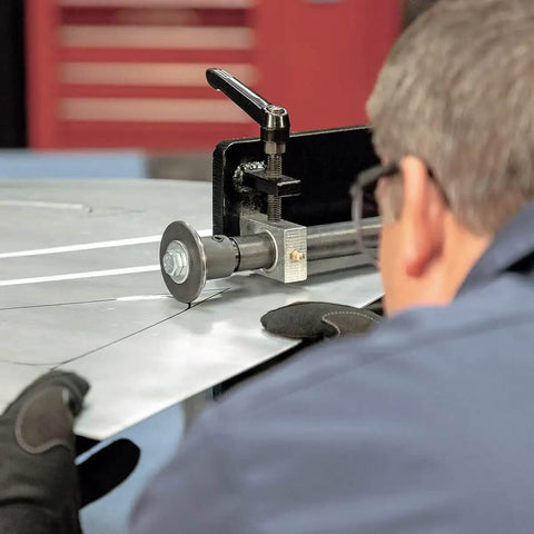 Person operating Budget-Friendly 19 Inch Metal Bead Roller With Power Drive System, forming channels on metal panel.