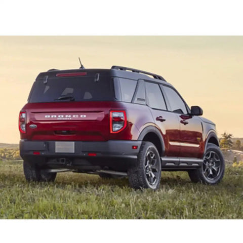 Ford Bronco 7 Inch Short Antenna Low Profile AM FM Radio Antenna Replacement on red SUV rear on grassy field