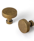 Two knobs from Six Pack Antique Brass Cabinet Knobs Set For Drawers And Cabinets, Solid Zinc Alloy One Hole Mount.