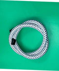 High Temperature Steamer Hose Replacement For All Steam Irons, Flexible PVC And Nylon Tube, Coiled on Green Background
