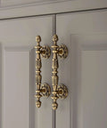 Five Pack Antique Brass Cabinet Handles With 3.4 Inch Hole Centers (107 Mm) Old School Vintage Drawer Pulls installed on cupboard
