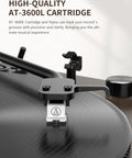 Close-up of AT-3600L cartridge tracking vinyl grooves on Bluetooth Turntable Player With Built In Phono Preamp And Magnetic Cartridge.