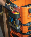 User accessing MODbox Parts Bin Rail Attachment on modular tool storage system with clear lid, side mount, one-handed release.