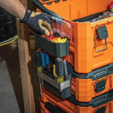 User accessing MODbox Parts Bin Rail Attachment on modular tool storage system with clear lid, side mount, one-handed release.