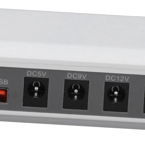 Solid Mini Ups With Six Thousand Mah Battery To Keep Your Wifi Router And Modem Running Smooth Through Power Blackouts And Internet Downtime Without A Hitch At Home Or Office power input ports close-up.