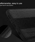 Black textured phone case corner showing precise cutouts for easy access to ports and buttons, showcasing craftsmanship.