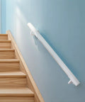 Built Like A Tank Two Foot White Steel Stair Railing With Heavy Duty Wall Mount Brackets installed on wooden steps.