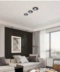 Image of 8 Pack Sharp Brass Round Dimmable LED Recessed Downlights 7W Anti Glare 4.2 Inch Ceiling Fixtures For Kitchen Living Room And Hallway Featuring Zero Hassle Snap Setup And Chic Decor Ring For Total Home Glow installed in modern living room ceiling.