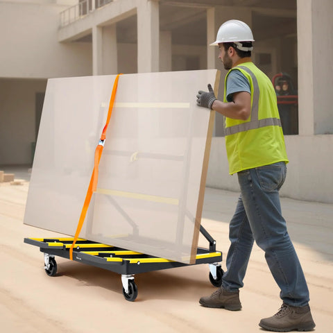 Worker using Drywall Cart Dolly With 1800 Lb Load Capacity And Expandable Deck carrying glass panel with tie down strap on construction site