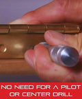 Hand using Replacement Point For 18A Automatic Center Punch With Adjustable Stroke, All Steel, to mark hinge hole.