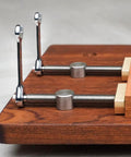 Close-up of Two Sets Adjustable Desktop Clip Vise For Woodworking Brass And Aluminum Fixture Clamp installed on wood surface.
