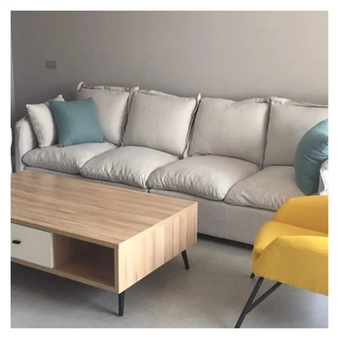 Living room with light sofa, wood table, and chairs featuring Adjustable Aluminum Furniture Legs In Sleek Black, 9.8 Inch Steel Feet.